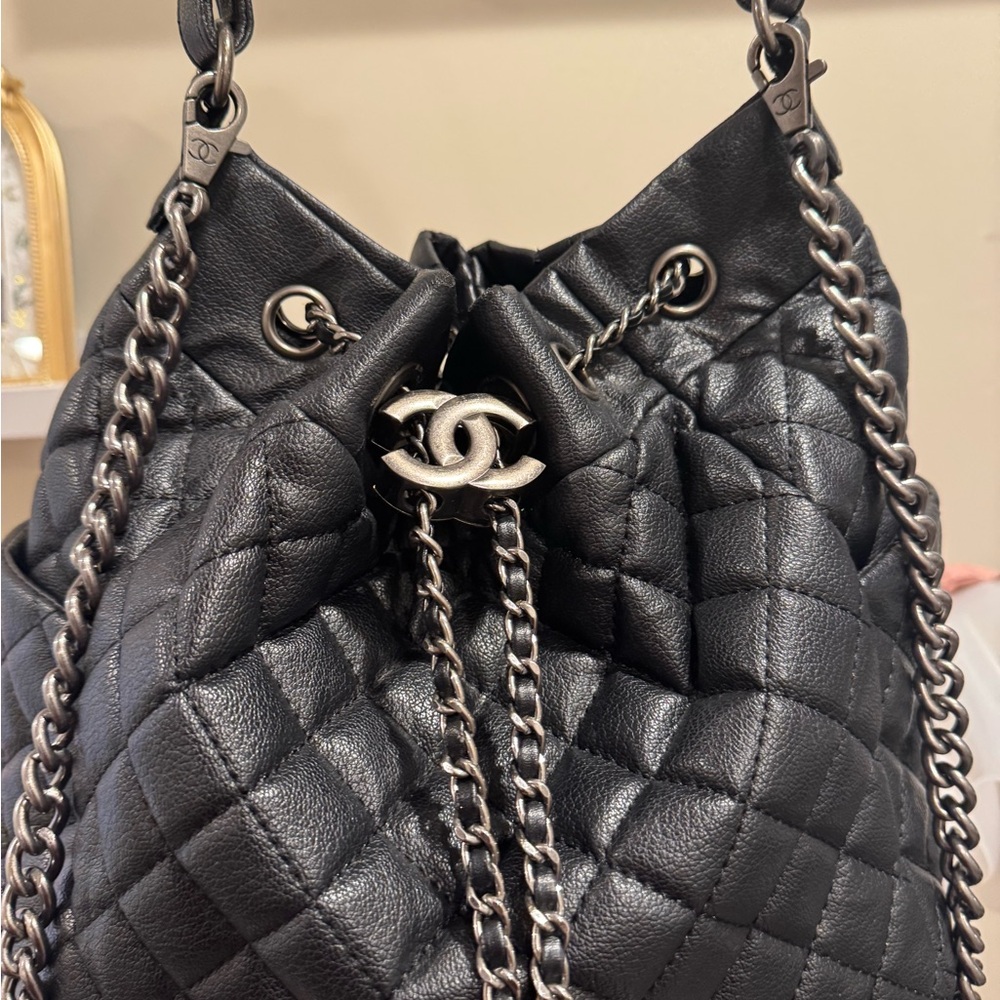 CHANEL Black Quilted Drawstring Shoulder Bag with Silver-Tone Chain